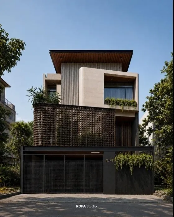 Narrow house with a terracotta screen and a dark gate on a quiet street